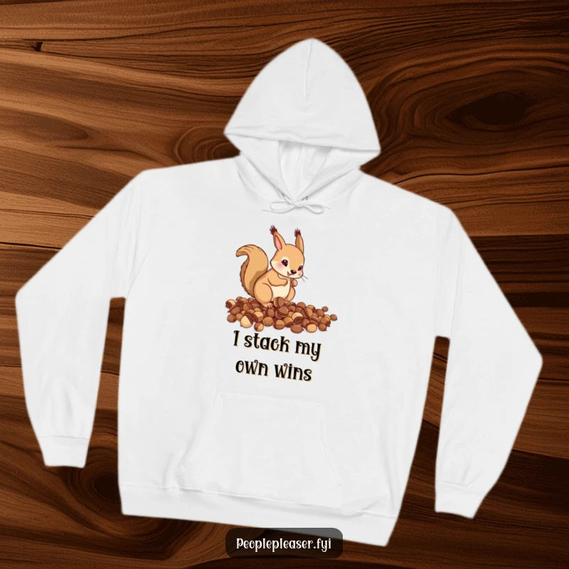 Funny Hoodie: A helpful squirrel is seen meticulously organizing a pile of scattered acorns, a humorous visual of tidiness in action.