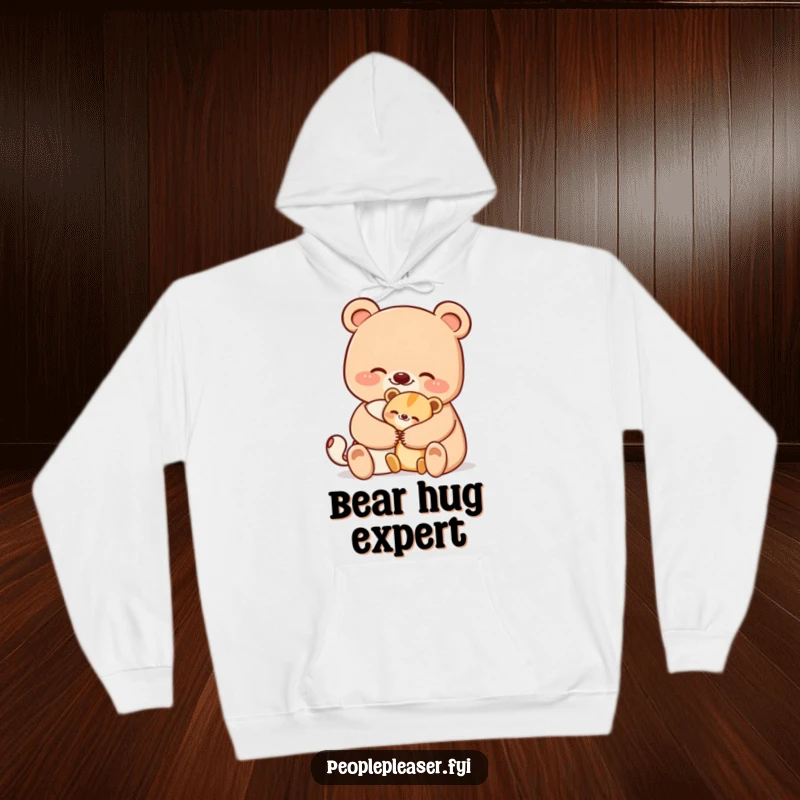 Funny bear hoodie showing a smiling bear character giving a comforting hug to a smaller animal, radiating cozy warmth and humor.